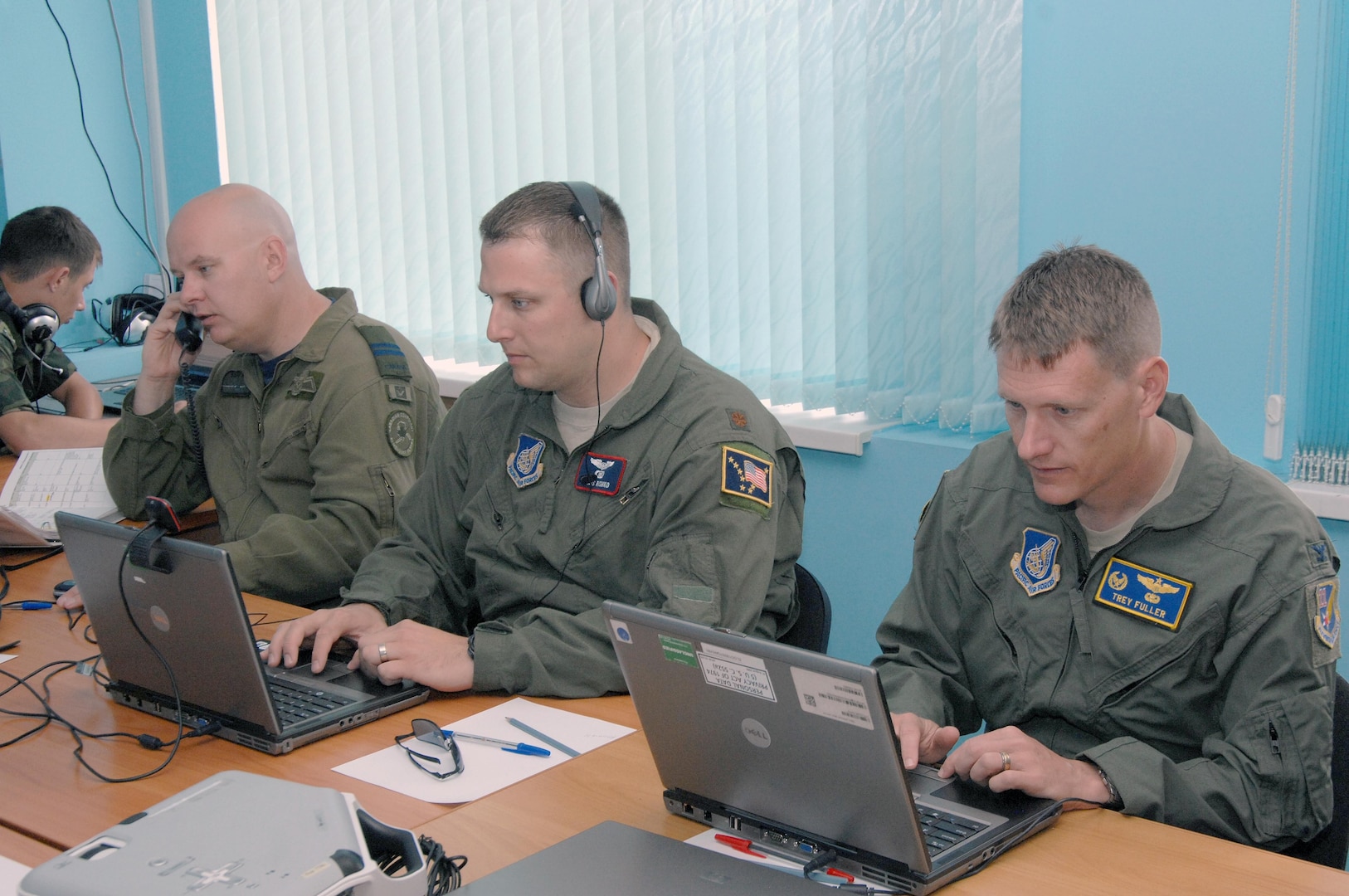 PETROPAVLOVSK-KAMCHATSKY,- Russia – (Left to right) Canadian Forces Capt. Steve McLean, 611th Air Operations Center, Maj. Chris Rishko, 176th Air Control Squadron, and Col. Trey Fuller, 611th AOC commander, coordinate with members of the North American Aerospace Defense Command and the Russian Federation Air Force during Exercise Vigilant Eagle Aug. 8, 2011. Vigilant Eagle is joint anti-terrorism exercise that focuses on cooperation between NORAD and Russian forces during the hijacking of an airliner. (U.S. Air Force photo by Tech. Sgt. Thomas J. Doscher)

