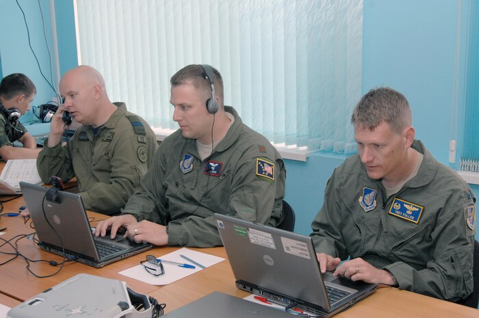 PETROPAVLOVSK-KAMCHATSKY,- Russia – (Left to right) Canadian Forces Capt. Steve McLean, 611th Air Operations Center, Maj. Chris Rishko, 176th Air Control Squadron, and Col. Trey Fuller, 611th AOC commander, coordinate with members of the North American Aerospace Defense Command and the Russian Federation Air Force during Exercise Vigilant Eagle Aug. 8, 2011. Vigilant Eagle is joint anti-terrorism exercise that focuses on cooperation between NORAD and Russian forces during the hijacking of an airliner. (U.S. Air Force photo by Tech. Sgt. Thomas J. Doscher)

