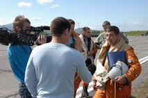 PETROPAVLOVSK-KAMCHATSKIY, Russia – Russian Federation Air Force Lt. Col. Sergey Pohilenko, SU-27 pilot, discusses Exercise Vigilant Eagle with members of the Russian media following the first day of flying Aug. 8, 2011. (U.S. Air Force photo by Tech. Sgt. Thomas J. Doscher)
