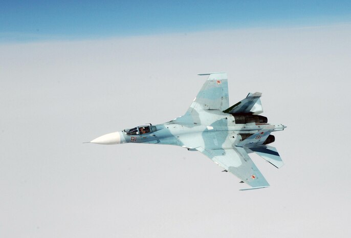 OVER THE PACIFIC OCEAN – An SU-27 fighter moves into position to  escort a simulated hijacked airliner during the second day of flying for Exercise Vigilant Eagle Aug. 9, 2011. Russian fighters followed and monitored the aircraft while it was in Russian airspace, handing it over to U.S. F-15 fighters from Elmendorf Air Force Base, Alaska, when it entered U.S. airspace. (U.S. Air Force photo by Tech. Sgt. Thomas J. Doscher)

