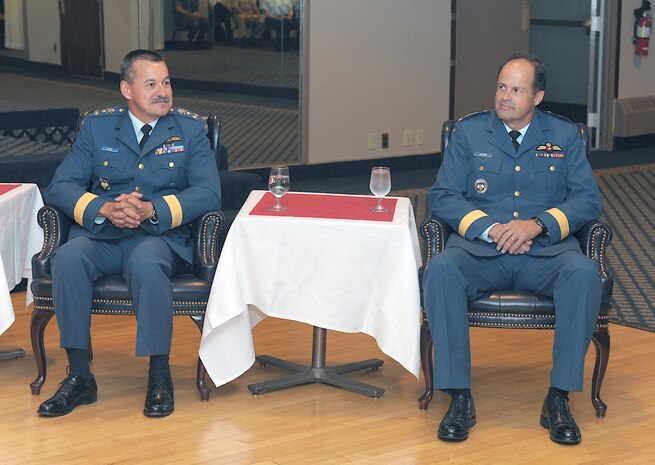 PETERSON AIR FORCE BASE, Colo. - Canadian Forces Lt.-Gen. Marcel Duval sits next to incoming North American Aerospace Defense Command deputy commander Lt.-Gen. Tom Lawson during the official change of office ceremony on Peterson Air Force Base, Colo., Aug. 15. Lt. Gen. Duval will be retiring after serving 36 years in uniform. He was previously the Deputy Commander of the Continental U.S. NORAD Region and the Commander of the Canadian NORAD Region. 

(U.S. Air Force photo by Tech. Sgt. Aaron Bujan) 

