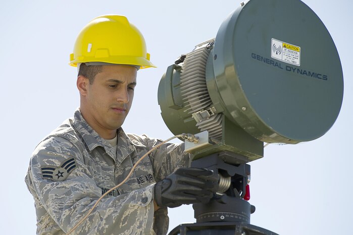 NAVAL AIR STATION KEY WEST, Fla. - Senior Airman Horacio Maysonet, 51st Combat Communications Squadron, Robins Air Force Base, Ga., perform set up and testing on radio frequency modules at Naval Air Station Key West, Fla., Nov. 5. The RFM consolidates radar feeds extending long distances into one air picture allowing higher headquarters to access and engage incoming threats. The exercise in Key West will be the "first-ever proof of concept" for the military's Joint Deployable Integrated Air and Missile Defense System, a collection of high-end radars and missile systems as well as aircraft that work in tandem in the event of a threat to the continental United States. 

(U.S. Air Force photo by Tech. Sgt. Dennis J. Henry Jr.) 

