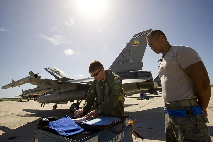 NAVAL AIR STATION KEY WEST, Fla. - Air Force Staff Sgt. Jam Baro, crew chief, from the 46th Aircraft Maintenance Squadron, blue aircraft maintenance unit, Eglin Air Force Base, Fla., and Air Force Maj. James Geoppinger review all paperwork before a mission during exercise Vigilant Shield 12 on Naval Air Station Key West, Fla., Nov. 6. The exercise in Key West will be the "first-ever proof of concept" for the military's Joint Deployable Integrated Air and Missile Defense System, a collection of high-end radars and missile systems as well as aircraft that work in tandem in the event of a threat to the continental United States. 

(U.S. Air Force photo by Tech. Sgt. Dennis J. Henry Jr.) 

