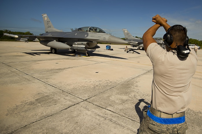 NAVAL AIR STATION KEY WEST, Fla. - Air Force Staff Sgt. Jam Baro, crew chief, from the 46th Aircraft Maintenance Squadron, blue aircraft maintenance unit, Eglin Air Force Base, Fla., prepares an F-16 Fighting Falcon for a mission during exercise Vigilant Shield 12 on Naval Air Station Key West, Fla., Nov. 6. The exercise in Key West will be the "first-ever proof of concept" for the military's Joint Deployable Integrated Air and Missile Defense System, a collection of high-end radars and missile systems as well as aircraft that work in tandem in the event of a threat to the continental United States. 

(U.S. Air Force photo by Tech. Sgt. Dennis J. Henry Jr.) 

