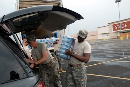 Louisiana National Guard Soldiers on hurricane relief duty in New Iberia, La., distribute water to thirsty residents of New Iberia Parish, on Sept. 2, 2008.