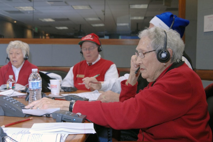PETERSON AIR FORCE BASE, Colo. - NORAD Tracks Santa volunteer Nancy Braede answers calls in the NTS Operations Center Dec. 24, 2011. Braede, visiting family from Ohio, volunteered for her second year.More than 1,200 volunteers in the 23-hour NORAD Tracks Santa operations center answered nearly 102,000 calls this year from children looking for Santa Claus (up over 20,000 from 2010). Volunteers ranged from Peterson AFB family members volunteering their time to First Lady Michelle Obama, who for the second year, answered NORAD Tracks Santa calls from Hawaii. (U.S. Air Force photo by Tech. Sgt. Thomas J. Doscher)