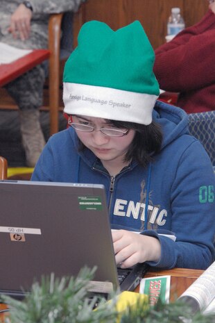 PETERSON AIR FORCE BASE, Colo. - Chiaki Matsui, 16, an exchange student from Tsu, Japan, answers NORAD Tracks Santa calls from English and Japanese speakers at the NTS Operations Center Dec. 24, 2011. More than 1,200 volunteers in the 23-hour NORAD Tracks Santa Operations Center answered nearly 102,000 calls from all over the world. (U.S. Air Force photo by Tech. Sgt. Thomas J. Doscher)