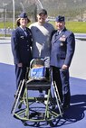 U.S. AIR FORCE ACADEMY, Colo. - Master Sgt. Christopher “Aggie” Aguilera, 66th Rescue Squadron aerial gunner, poses for a photo with Maj. Gen. Howard Thompson, North American Aerospace Defense Command and U.S. Northern Command chief of staff, and Col. Tamra Rank, U.S. Air Force Academy vice superintendent, following the presentation of Aguilera's new sports wheelchair by the Air Force Association and DRS Technologies at the Air Force Academy, April 23. Aguilera was one of two survivors from a HH-60G Pave Hawk helicopter crash in southwest Afghanistan that killed five Airmen June 9, 2010. He has returned to active duty in the Air Force, and is discovering a new normal for his life as he adapts to his injuries. Aguilera is a member of the 2012 Air Force Team for the Warrior Games in rifle and pistol shooting, various track events, sitting volleyball and wheelchair basketball. 

(U.S. Air Force photo by Elizabeth Andrews) 


