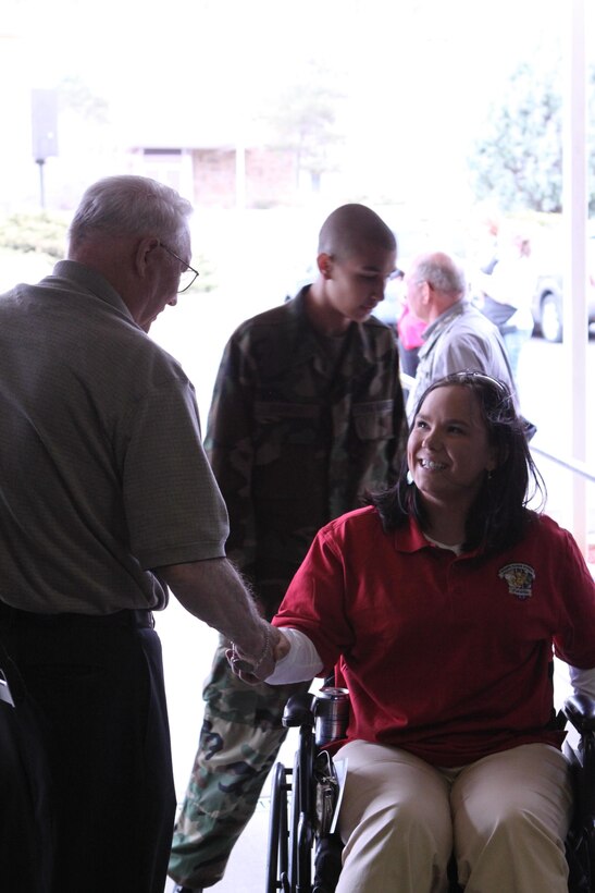 Cpl. Breanna Dill, a native of Saint Francis, Minn., and member of the Wounded Warrior Battalion West is welcomed to Colorado by members of the Veterans of Foreign Wars. Dill and 49 other Marines are here for the All-Marine Warrior Games team two-week training camp. The camp will prepare the athletes for the fourth annual Warrior Games that will be held at the Olympic Training Center and Air Force Academy in Colorado Springs, Colo., May 10-16. The Marines will continue to train hard for the remaining week and are looking forward to defending their first place title against the Army, Navy /Coast Guard, Air Force and SOCOM.  (Photo by Aquita Brown)