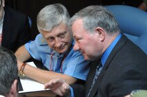 PETERSON AIR FORCE BASE, Colo. - Russian General-Major Sergey Vladimirovich Dronov, commander-in-chief of the 3rd Air Force Air Defense Command Eastern Military District, and Joseph C. Bonnet III, Director of Joint Training and Exercises for North American Aerospace Defense Command and United States Northern Command, converse during an exercise scenario during Vigilant Eagle 12 at NORAD headquarters on Peterson Air Force Base, Colo., Aug. 28, 2012. This year’s exercise scenario focused on procedures for monitoring the situation and cooperative hand-off of the track of interest from one nation to the other while exchanging information. (U.S. Air Force photo by Tech. Sgt. Thomas J. Doscher)