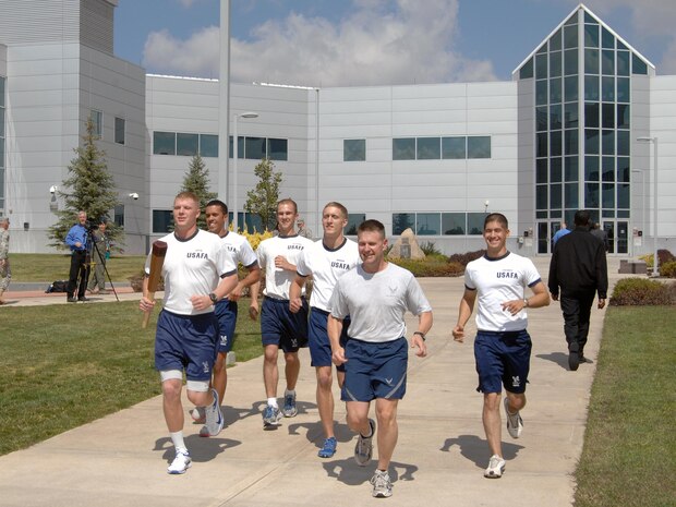 PETERSON AIR FORCE BASE, Colo. - Air Force Brig. Gen. Gregory Lengyel, U.S. Air Force Academy Commandant (center-right) leads five Air Force Academy cadets on the first leg of the Remembrance Run, which started at NORAD and USNORTHCOM headquarters Sept. 13, 2012. The Remembrance Run, conducted in recognition of POW/MIA Recognition Day as well as the victims of 9/11, is a relay run spanning 45 miles through Colorado Springs. Each five-person team of cadets runs one mile, ending with a 39-hour run commemorating the 39 years since Operation Homecoming, which airlifted U.S. prisoners of war from North Vietnam. 

(U.S. Air Force photo by Tech. Sgt. Thomas J. Doscher) 

