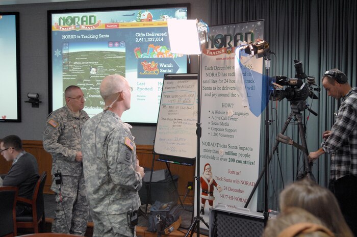 PETERSON AIR FORCE BASE, Colo. - Army Maj. Gen. Charles Luckey, NORAD and USNORTHCOM Chief of Staff, prepares to do a media interview via satellite from the NORAD Tracks Santa Operations Center Dec. 24, 2012. Dozens of interviews were conducted with NORAD leadership to get the word out on how NORAD tracks Santa every year. (U.S. Navy photo by LCDR. Bill Lewis)