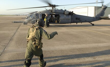 Crewmembers from the 55th Rescue Squadron perform preflight checks on a HH-60 Pave Low Sept. 3 at Ellington Field, Texas. The squadron deployed from Davis-Mothan Air Force Base, Ariz., to Ellington Field in response to Hurricane Gustav with less than 24 hours after notification.