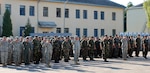 Servicemembers from the U.S., Ukraine, and 16 other countries present arms for the playing of the American and Ukrainian anthems during the Rapid Trident opening Ceremony.