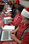 PETERSON AIR FORCE BASE, Colo. - NORAD Tracks Santa volunteers answer emails from Santa trackers across the globe at the NORAD Tracks Santa Operations Center Dec. 24, 2012. The NTS Operations Center receive more than 11,000 emails, but was only able to answer 7,000. (U.S. Navy photo by LCDR Bill Lewis)