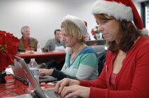 PETERSON AIR FORCE BASE, Colo. - NORAD Tracks Santa volunteers answer emails from Santa trackers across the globe at the NORAD Tracks Santa Operations Center Dec. 24, 2012. Although calling on the phone is the traditional way of contacting NORAD Tracks Santa, volunteers also answered more than 7,000 emails from people looking for Santa. (U.S. Navy photo by LCDR Bill Lewis)