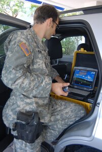 A Soldier prepares to transmit a situation report on pre-storm activities in Key West, Fla., Sept. 8, 2008.