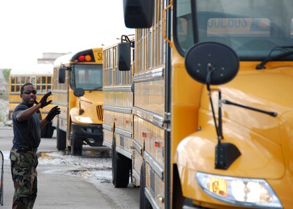 Staff Sgt. Cody Flatts of the 149th Logistics Readiness Squadron, 149th Fighter Wing, Texas Air National Guard directs buses to be fueled. The buses were dispatched from the Dallas county school district to Kelly USA, San Antonio, Texas for the Hurricane Ike evacuee efforts. Texas Military Forces began mobilization efforts today.