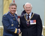 OTTAWA - Canadian Lt.-Gen. Alain Parent shakes hands with David Johnston, Governor General and Commander-in-Chief of Canada, following a ceremony investing Parent into the Order of Military Merit for the second time. The level of commander recognizes outstanding meritorious service and demonstrated leadership in duties of great responsibility. Parent was originally invested into the Order of Military Merit in 2008. 

(Canadian Forces photo by Cpl. Roxanne Shewchuk) 

