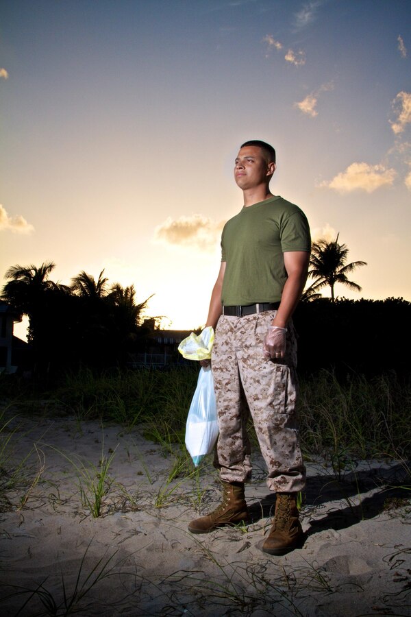 Marine Sgt. Javier Melendez, a recruiter with Marine Corps Recruiting Substation Delray Beach, Fla., clears south Florida beaches of hazardous debris April 24, 2013 as part of a partnership with Palm Beach County Parks and Recreation. Beginning this May, Marines with Recruiting Substations West Palm Beach and Delray Beach will be a prominent sight as they clear and clean area beaches of trash and debris washed ashore by tides or left behind by beach goers.  