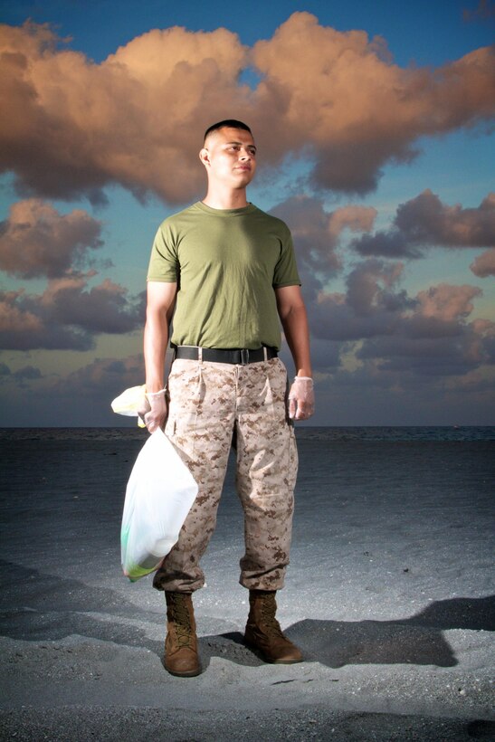 Marine Sgt. Javier Melendez, a recruiter with Marine Corps Recruiting Substation Delray Beach, Fla., clears south Florida beaches of hazardous debris April 24, 2013 as part of a partnership with Palm Beach County Parks and Recreation. Beginning this May, Marines with Recruiting Substations West Palm Beach and Delray Beach will be a prominent sight as they clear and clean area beaches of trash and debris washed ashore by tides or left behind by beach goers.  