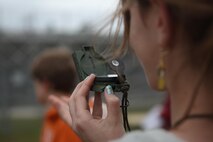 A seventh-grade student looks at a compass to determine direction during a land navigation class taught by Marines with Combat Logistics Regiment 27, 2nd Marine Logistics Group at Brewster Middle School aboard Camp Lejeune, N.C., April, 25, 2013. The Marines instructed students how to properly use maps, protractors and compasses to find locations without the use of technology such as GPS units. 