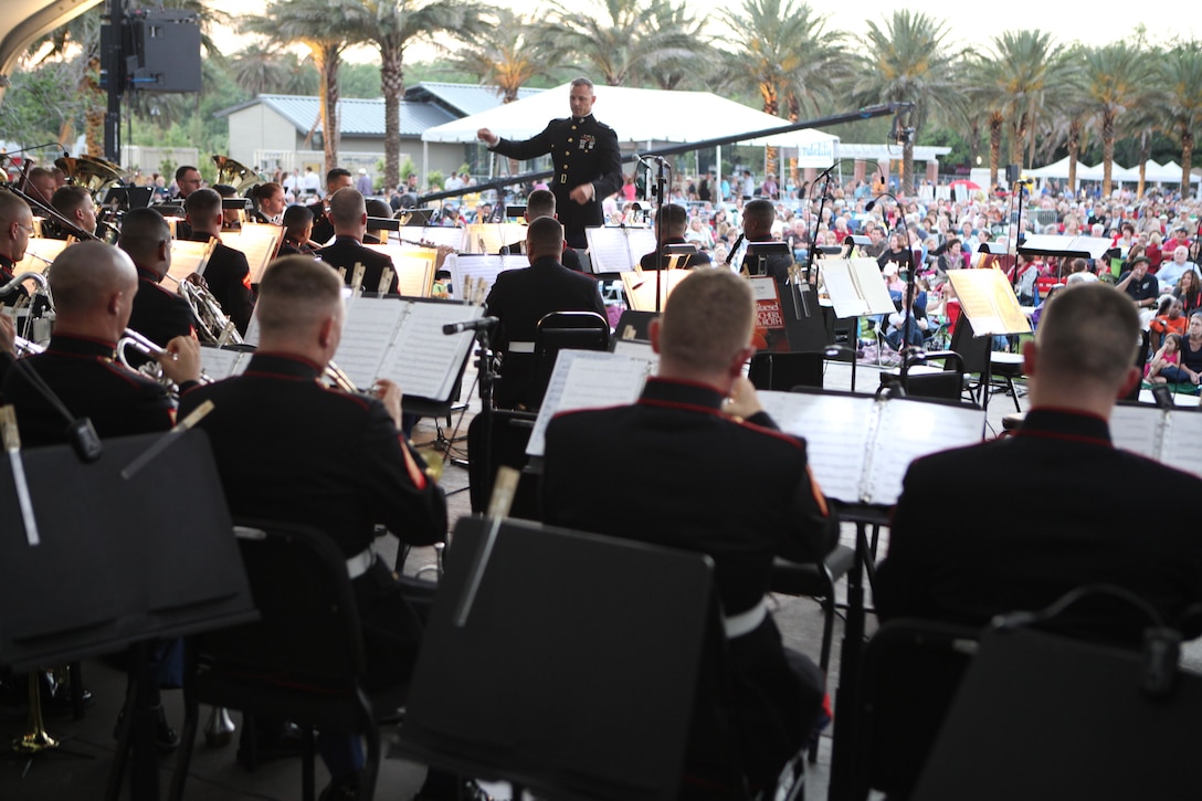 Hundreds watch and listen as Chief Warrant Officer 2 Bryan Sherlock, Marine Forces Reserve Band New Orleans officer-in-charge, conducts at the Great Lawn in New Orleans City Park, during the “Swing in the Oaks,” Louisiana Philharmonic Orchestra and MFR Band New Orleans concert, April 25. This historic concert was the first time these organizations had teamed up for a performance in either institution’s existence.