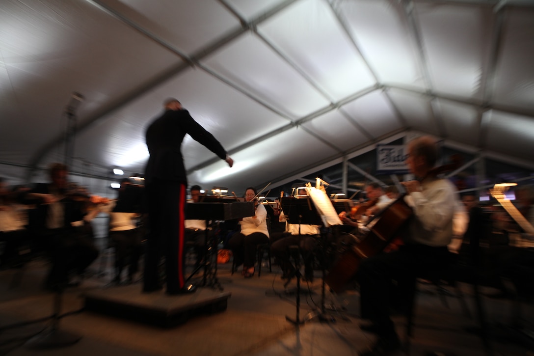 Marine Forces Reserve Band New Orleans’ officer-in-charge, Chief Warrant Officer 2 Bryan Sherlock, conducts the Louisiana Philharmonic Orchestra during LPO and MFR Band New Orleans performance of “Swing in the Oaks,” April 25. This historic concert was the first time these two organizations had performed together in either institution’s history.