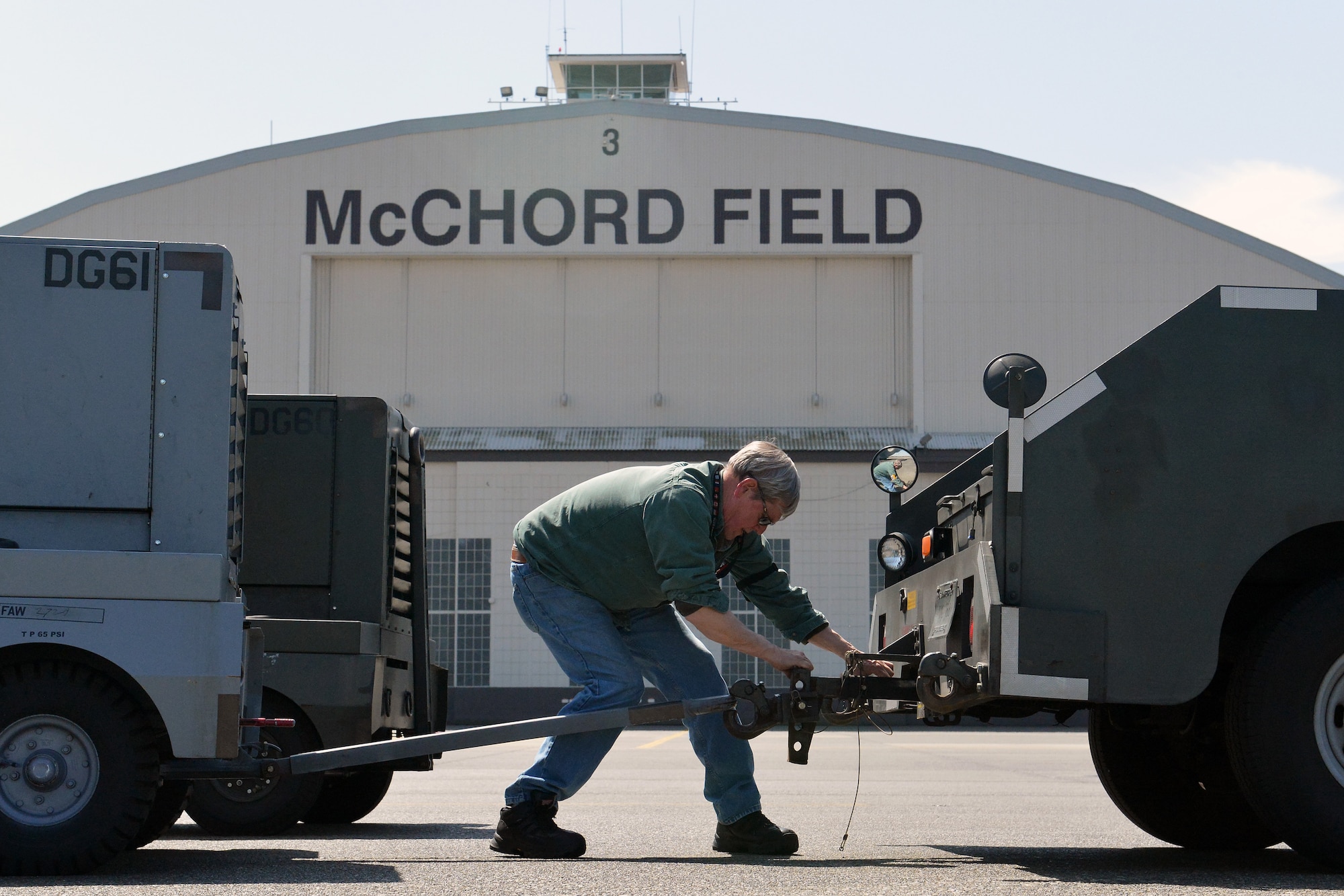Robert Weaver, 62nd Maintenance Squadron Aerospace Ground Equipment power systems support technician changes out a generator that’s low on fuel, April 25, 2013 at Joint Base Lewis-McChord, Wash.The 62nd MXS AGE shop is comprised of active duty Airmen, reservist, and civilian technicians. (U.S. Air Force photo/Airman 1st Class Jacob Jimenez)