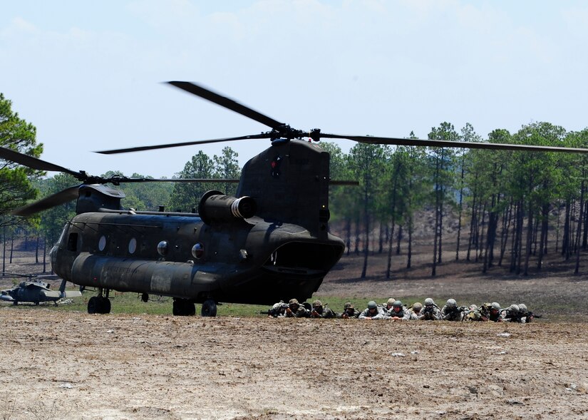 Joint Task Force-Bravos Joint Security Forces and Honduran Air Force and Army personal secure the area during a Isolated Personnel Recovery Exercise, April 25. The exercise is designed to test the capabilities of the JSF and Hondurans ability to secure the isolated personnel and for the medics to asses and extract the injured. The continued joint training hones JTF-B and the Honduran military skills for a real world emergency. (Air Force photo by Staff Sgt. Eric Donner)