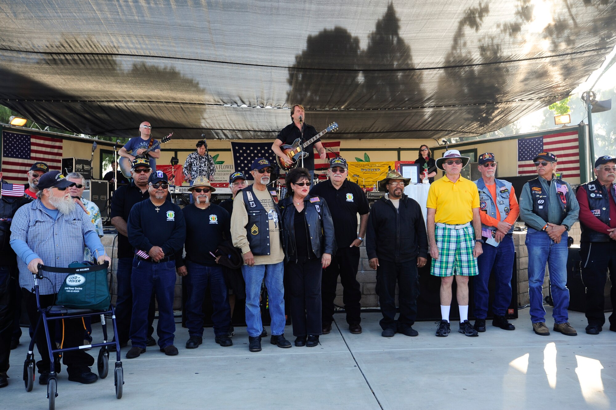 SANTA MARIA, Calif. – Vietnam veteran’s stand near stage for applauses and salute during the Santa Maria Valley Strawberry Festival Saturday, April 27, 2013. Military members and veterans received free admission to the festival and a military appreciation concert by Rockie Lynne. (U.S. Air Force photo/Airman Yvonne Morales)