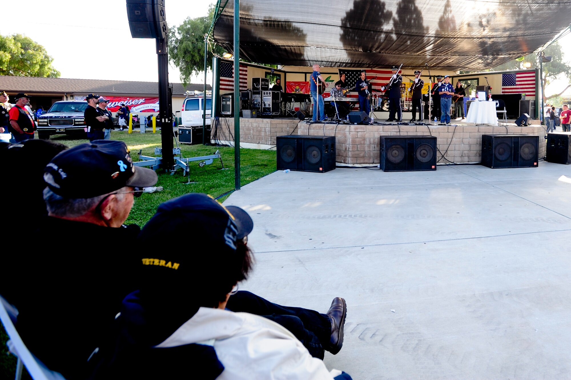 SANTA MARIA, Calif. – Veterans watch the Vandenberg Air Force Base Honor Guard perform during the Santa Maria Valley Strawberry Festival Saturday, April 27, 2013 Military members and veterans received free admission to the festival and a military appreciation concert by Rockie Lynne. (U.S. Air Force photo/Airman Yvonne Morales)