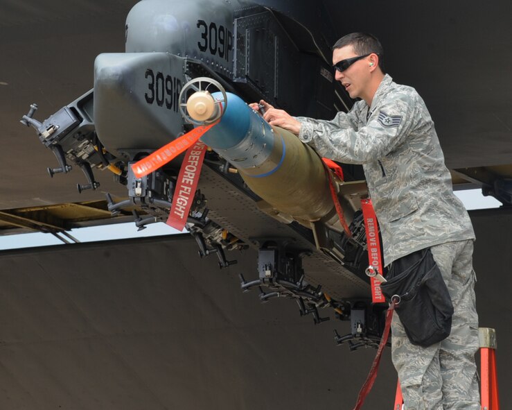 Staff Sgt. Brandon Brewer, 2nd Aircraft Maintenance Squadron load crew team chief, inspects a loading station during a weapon's load competition on Barksdale Air Force Base, La., April 26, 2013. Load teams are graded on dress and appearance, a written test, a tool box inspection and the weapons load process. (U.S. Air Force photo/Senior Airman Sean Martin)