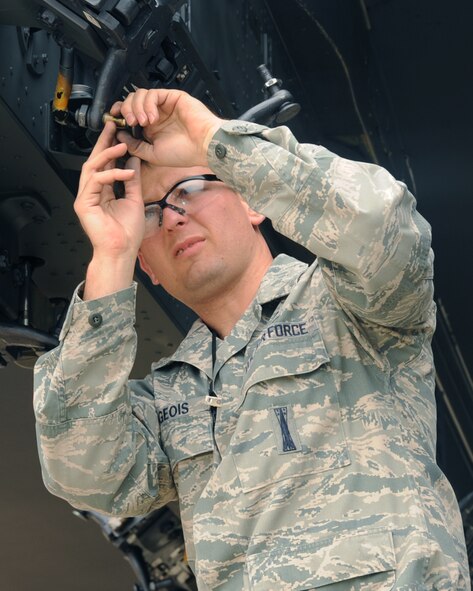 Senior Airman Kyle Burgeois, 2nd Aircraft Maintenance Squadron weapons loader, prepares a loading station on a B-52H Stratofortress during a weapon's load competition on Barksdale Air Force Base, La., April 26, 2013. Load teams are graded on dress and appearance, a written test, a tool box inspection and the weapons load process. (U.S. Air Force photo/Senior Airman Sean Martin)