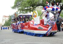 The 2013 Military Ambassadors for Joint Base San Antonio took part in the Battle of Flowers Parade as part of the Fiesta celebration activities April 26, at the Alamo Plaza San Antonio Texas. (U.S. Air Force photo by Benjamin Faske) (released)