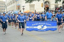 The Randolph High School Marching Band particpated in Fiesta by marching in the 2013 Battle of Flowers Parade April 26, at the Alamo Plaza San Antonio Texas. (U.S. Air Force photo by Benjamin Faske) (released)