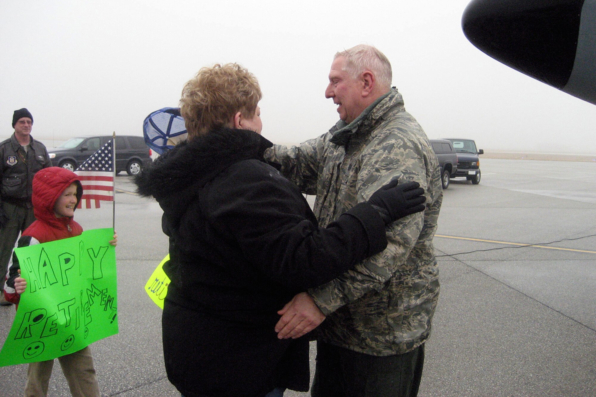 GRISSOM AIR RESERVE BASE, Ind. -- Lt. Col. Don Windt Windt, 74th Air Refueling Squadron pilot, is greeted by his family after his final flight with a KC-135R Stratotanker here March 18. Windt retired March 24 with approximately 36-and-one-half years of military service. (U.S. Air Force Photo/Sonya Brown)