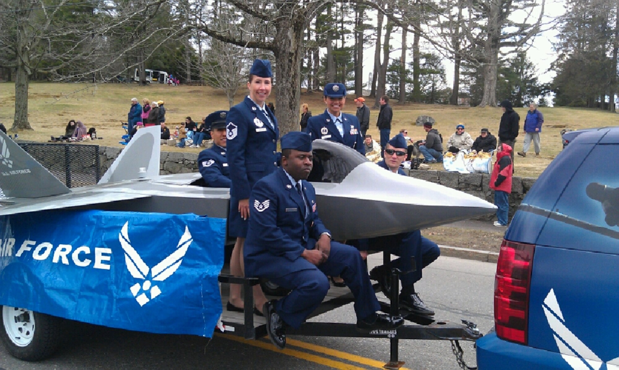 Members of the 319th Recruiting Squadron B Flight ride on a float during the Lexington 300 Patriots Day Parade April 14 in Lexington, Mass. This civic holiday commemorates the anniversary of the Battle of Lexington and Concord, the first battles of the American Revolutionary War as well as the incorporation of Lexington as a town. (U.S. Air Force photo/Tech. Sgt. Bill Spreng)
