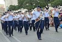 The U.S. Air Force Band of the West, marched in the 2013 Battle of Flowers Parade as part of the Fiesta celebration April 26, at the Alamo Plaza San Antonio Texas. (U.S. Air Force photo by Benjamin Faske) (released)