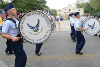 The U.S. Air Force Basic Miltary Training, Marching Band, took part in Fiesta activities by marching in the Battle of Flowers Parde April 26, at the Alamo Plaza San Antonio Texas. (U.S. Air Force photo by Benjamin Faske) (released)