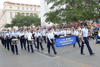 The U.S. Air Force Basic Miltary Training Marching Band, took part in Fiesta activities by marching in the Battle of Flowers Parde April 26, at the Alamo Plaza San Antonio Texas. (U.S. Air Force photo by Benjamin Faske) (released)