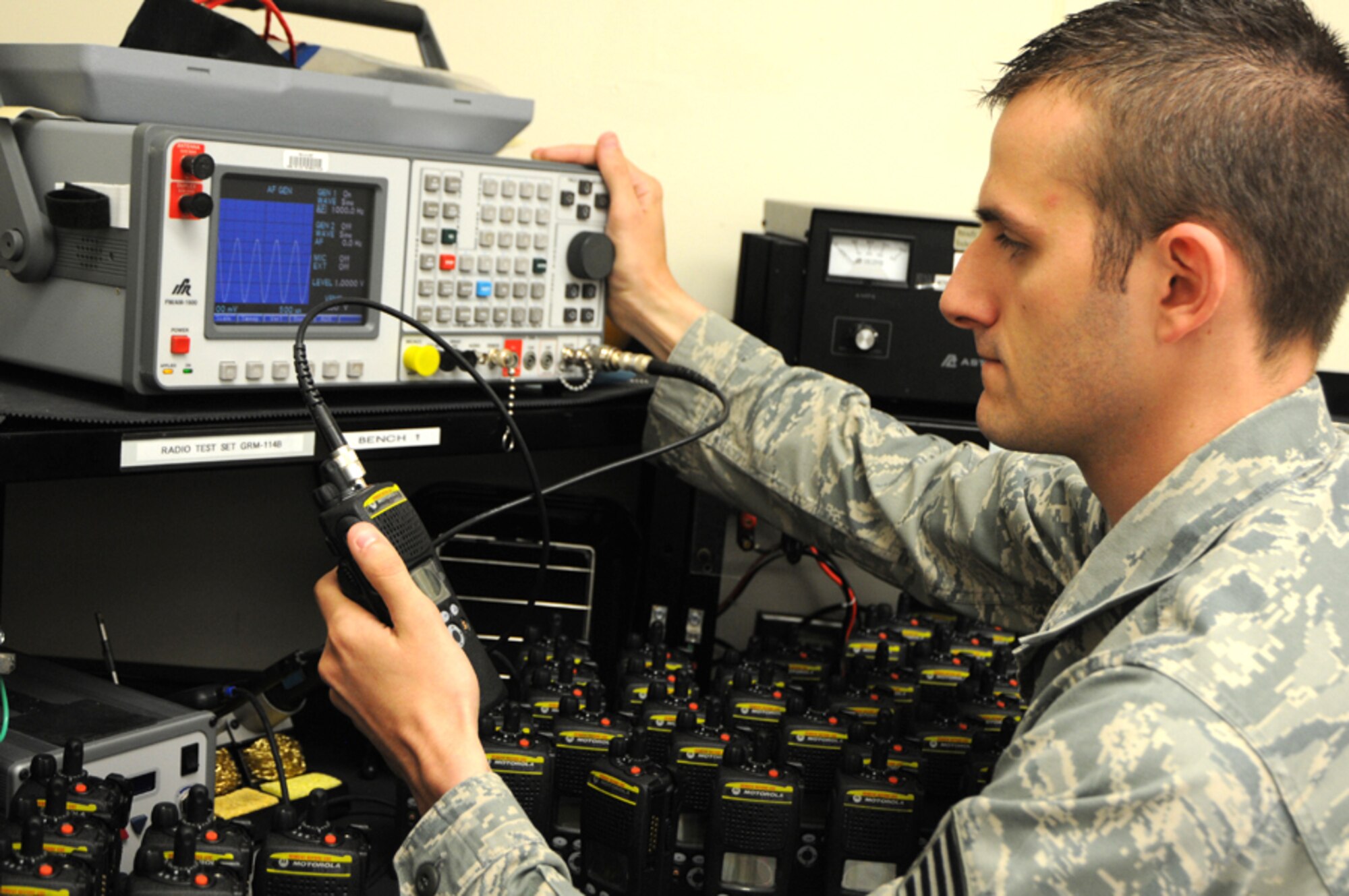 As more than 400 new radios arrived from National Guard Bureau on Apr. 24, Staff Sgt. Sean Bryson, from the 124th Communications Flight, finishes the final preparation on the encrypted radios by inspecting and testing every radio before issuing and distributing the radios to units on Gowen Field. Bryson tests power, frequency error, receive sensitivity, modulation and threshold squelch. (U.S. Air Force photo by Tech. Sgt. Becky Vanshur)