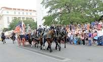 The Military Honors Caisson platoon marched in the  2013 Battle of Flowers Parade April 26 as part of the Fiesta celebration, at the Alamo Plaza San Antonio Texas. (U.S. Air Force photo by Benjamin Faske) (released)