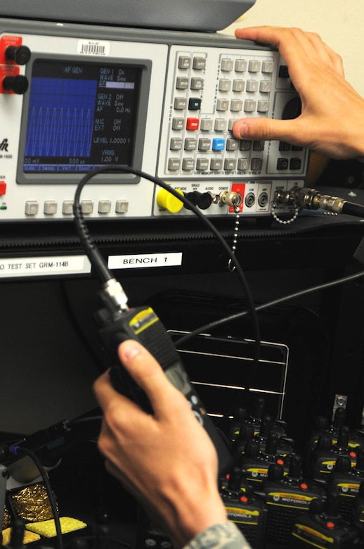 As more than 400 new radios arrived from National Guard Bureau on Apr. 24, Staff Sgt. Sean Bryson, from the 124th Communications Flight, finishes the final preparation on the encrypted radios by inspecting and testing every radio before issuing and distributing the radios to units on Gowen Field. Bryson tests power, frequency error, receive sensitivity, modulation and threshold squelch. (U.S. Air Force photo by Tech. Sgt. Becky Vanshur)