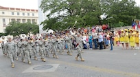 The U.S. Army North Marching Band participated in the 2013 Battle of Flowers Parade April 26, at the Alamo Plaza San Antonio Texas. (U.S. Air Force photo by Benjamin Faske) (released)