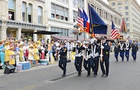 The color guard marches down Alamo St. to kick off the Battle of Flowers Parade during the Fiesta celebration April 26, at the Alamo Plaza San Antonio Texas. (U.S. Air Force photo by Benjamin Faske) (released)
