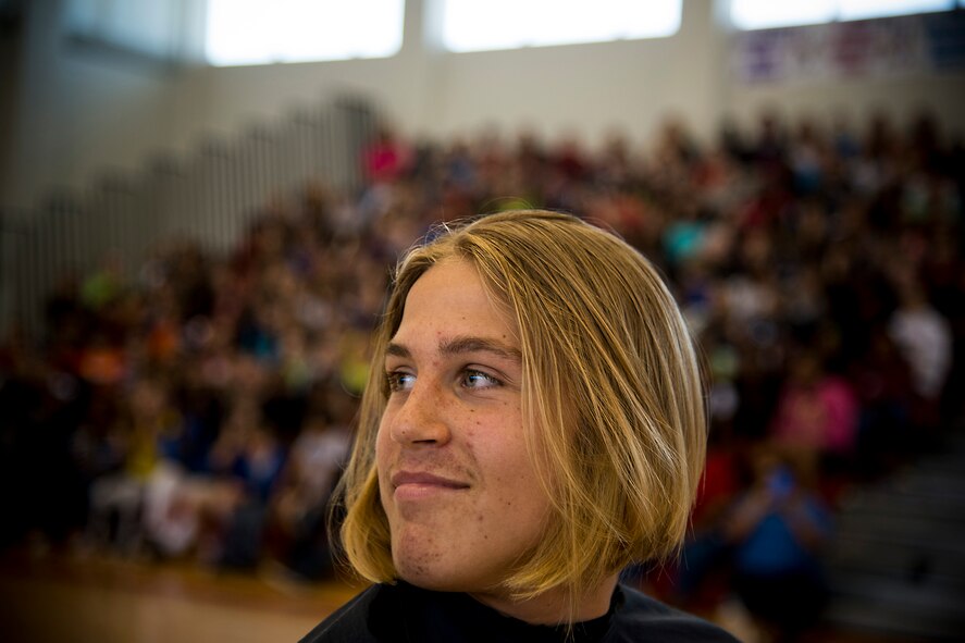 Ian Lamp, son of U.S. Air Force Master Sgt. John Lamp, 23d Component Maintenance Squadron first sergeant, sports a new hairdo April 26, 2013, at Pine Grove Middle School, Valdosta, Ga. Lamp’s hair was 22 inches long before having 14 inches of it cut for donation to Locks of Love. (U.S. Air Force photo by Staff Sgt. Jamal D. Sutter/Released) 
