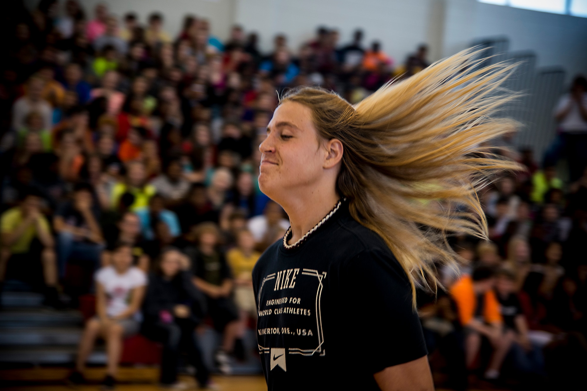 Ian Lamp, son of U.S. Air Force Master Sgt. John Lamp, 23d Component Maintenance Squadron first sergeant, approaches center-court April 26, 2013, at a Pine Grove Middle School gymnasium in Valdosta, Ga. The 14-year-old 8th grader cut and donated 14 inches of his hair to Locks of Love. (U.S. Air Force photo by Staff Sgt. Jamal D. Sutter/Released)
