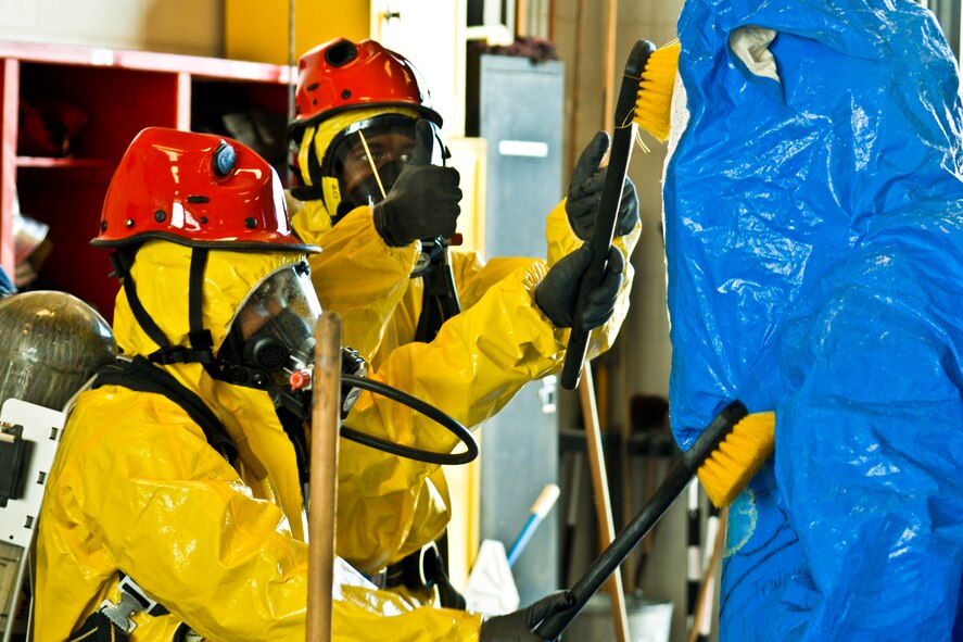 Illinois Army National Guard soldiers practice communicating during decontamination procedures while in protective gear during an exercise at the 182nd Airlift Wing in Peoria, Ill., April 4, 2013.  Illinois National Guard airmen and soldiers received hazardous materials training from the Illinois Fire Service Institute to enhance their capabilities as the state's Chemical, Biological, Radiological/Nuclear and High Explosive Response Force Package team.  (U.S. Air National Guard photo by Staff Sgt. Lealan Buehrer/Released)