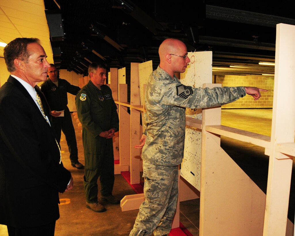 Congressman Chris Collins (NY-27) is being briefed by MSgt. Stephen Houseman (right), 914th Security Forces Squadron Combat Arms NCOIC while Col. John Higgins (center), Commander, 107th Airlift Wing and others look on at the Niagara Falls Air Reserve Station on April 29, 2013. The Congressman was at the base for an official fact finding tour of the units and its facilities at the base. (U.S. Air Force Reserve photo by Peter Borys)